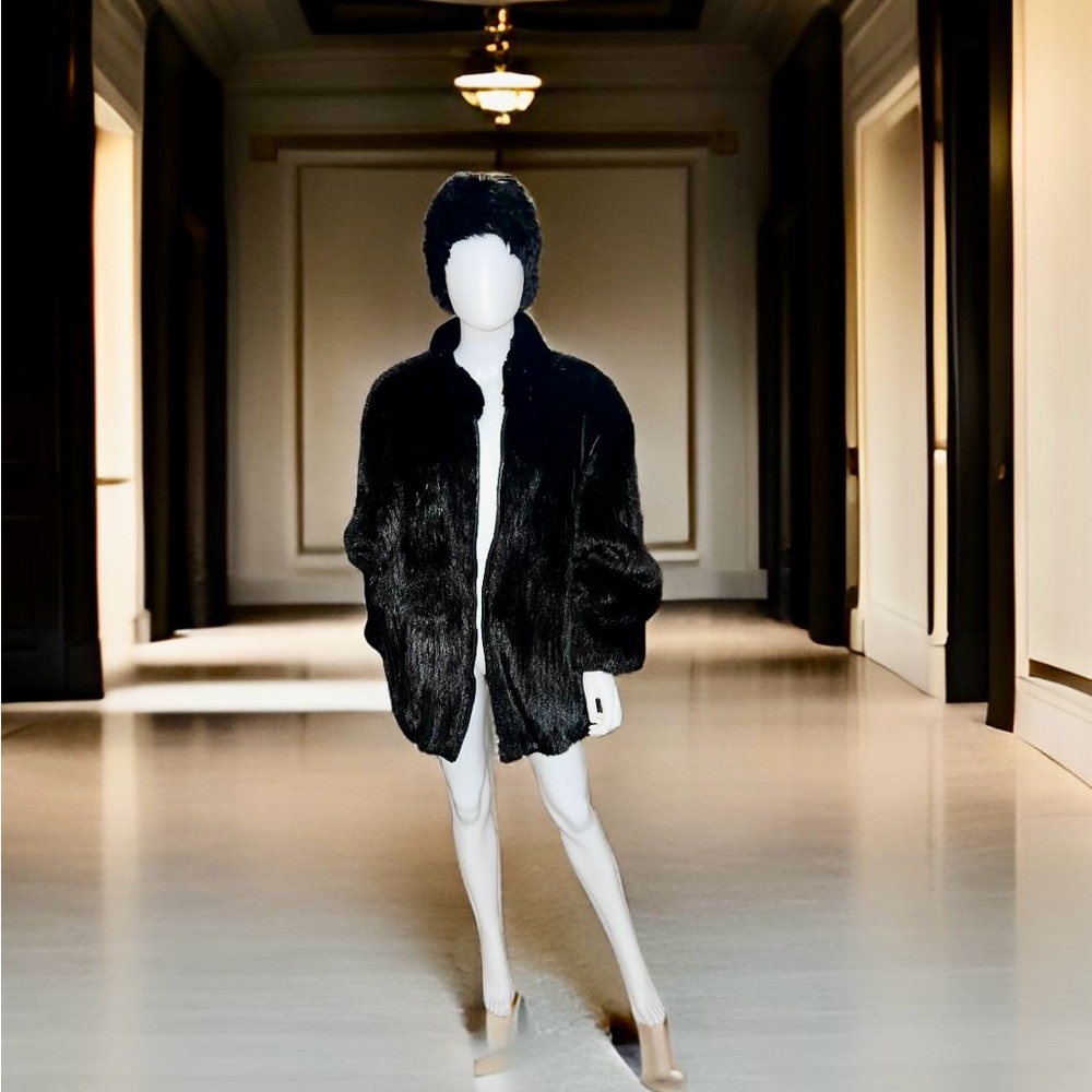 Luxe mink mid length coat, fully lines with supple black leather